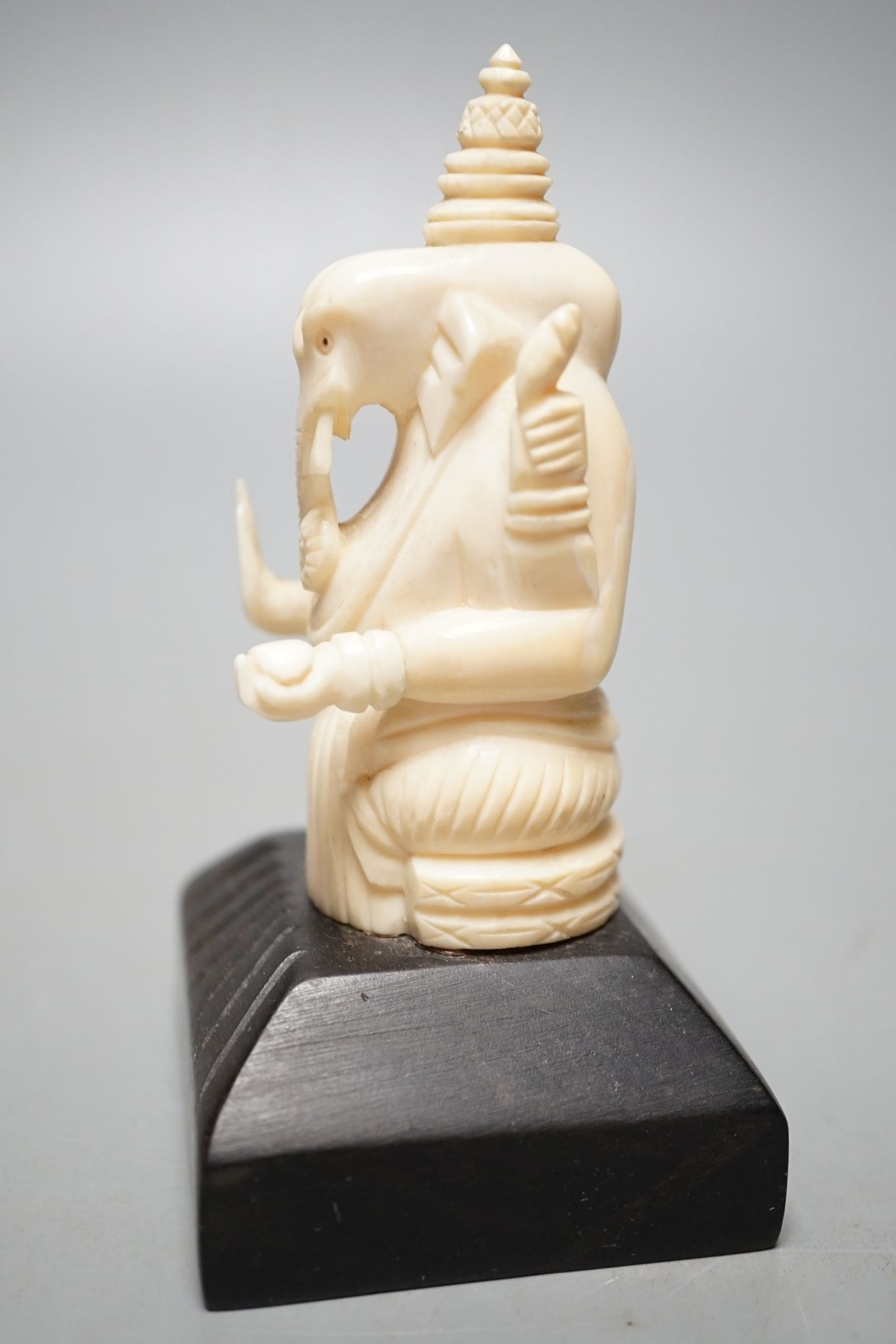 An Indian ivory letter opener, 38cm, and a Ganesh figure